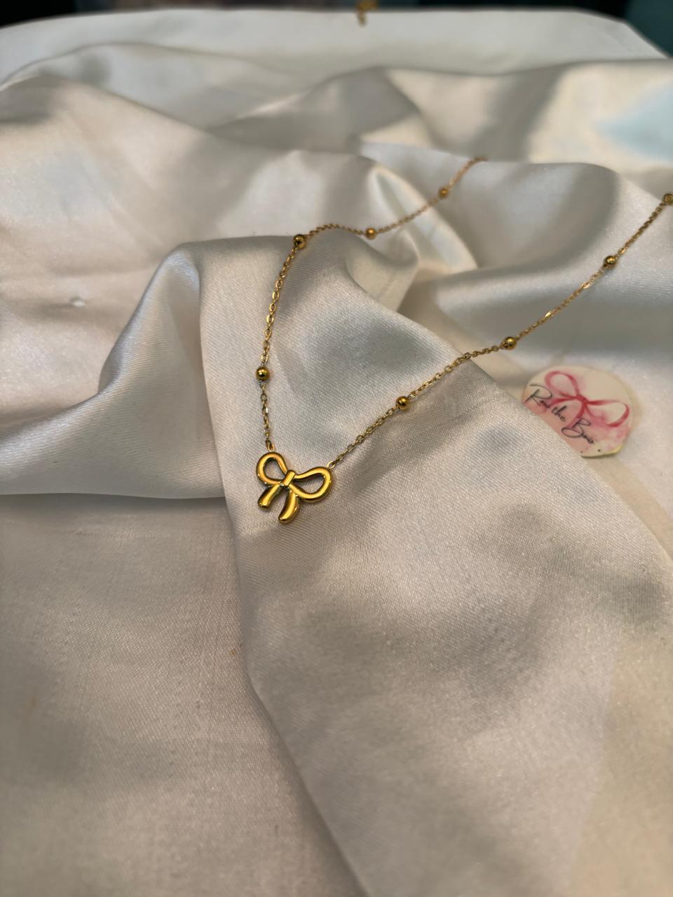 Golden Bow Pendant